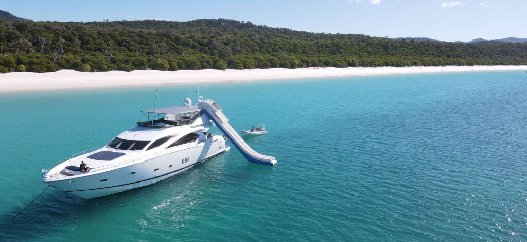 M/Y ALANI at anchor off Whitehaven Beach with the waterslide out