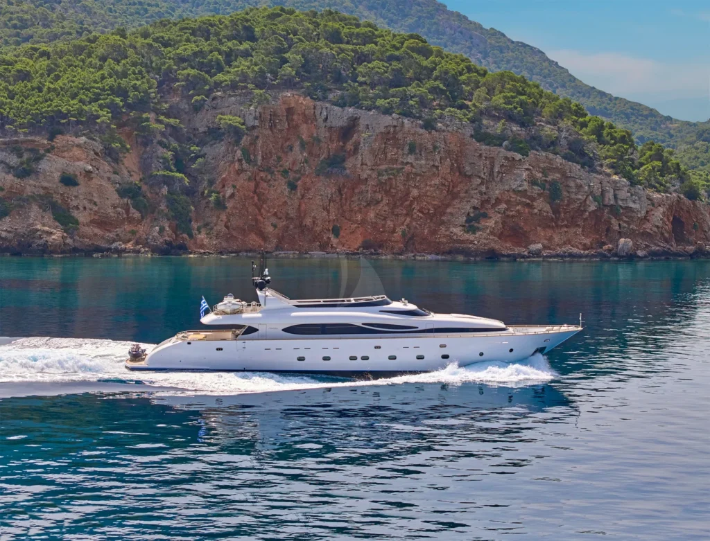 M/Y ANASA cruising past a wooded coastline in Greece